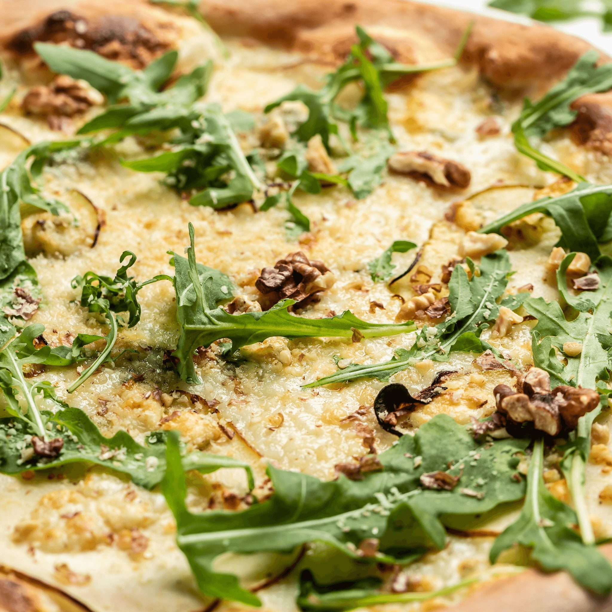 Arugula pizza slice.