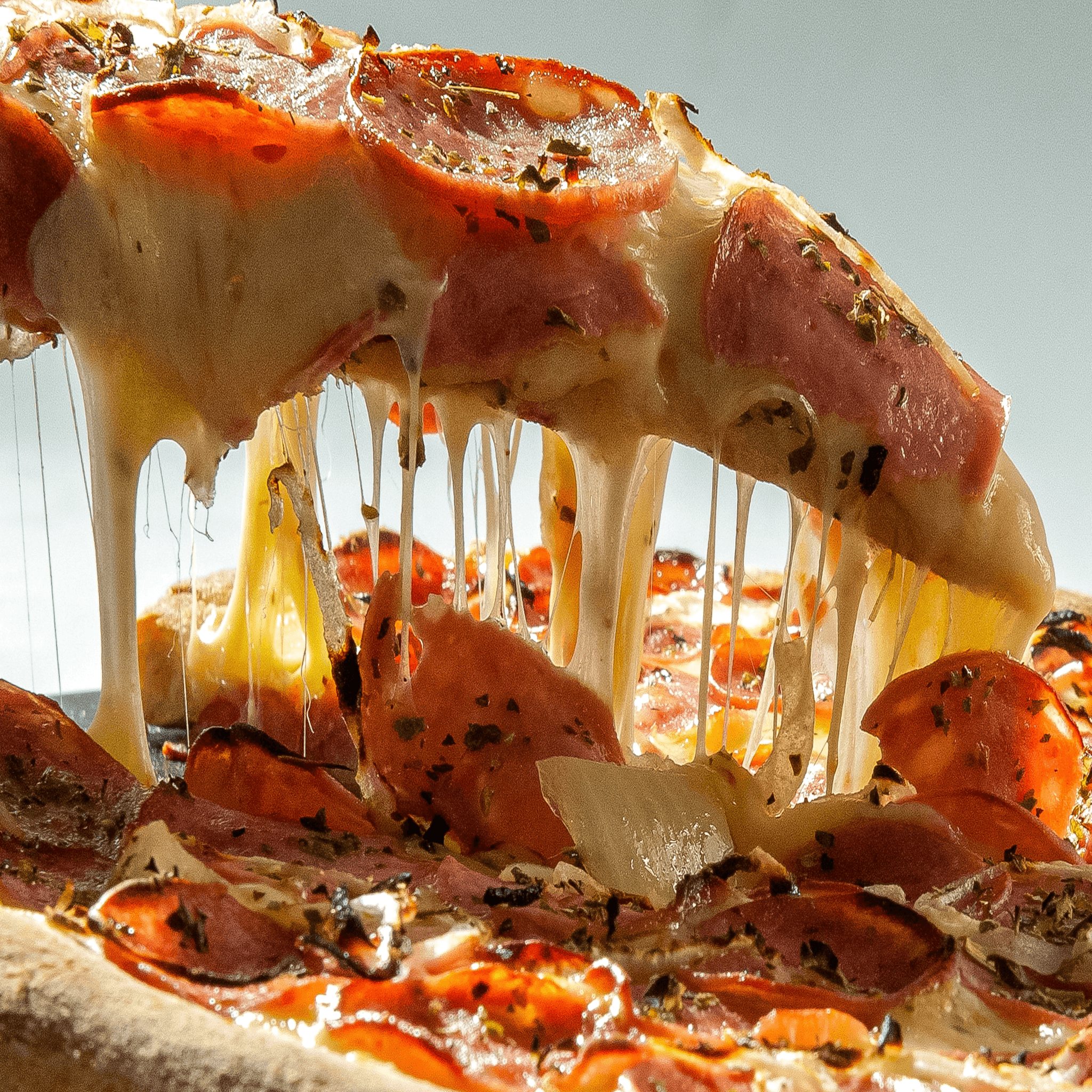 Sicilian pepperoni pizza slice.