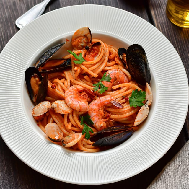 Mussels Marinara over Linguine.
