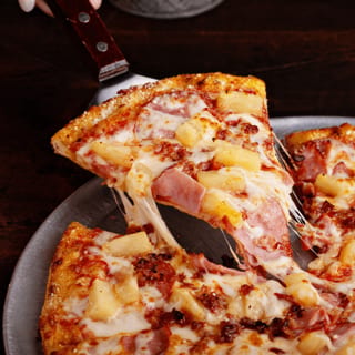 Hawaiian pizza slice