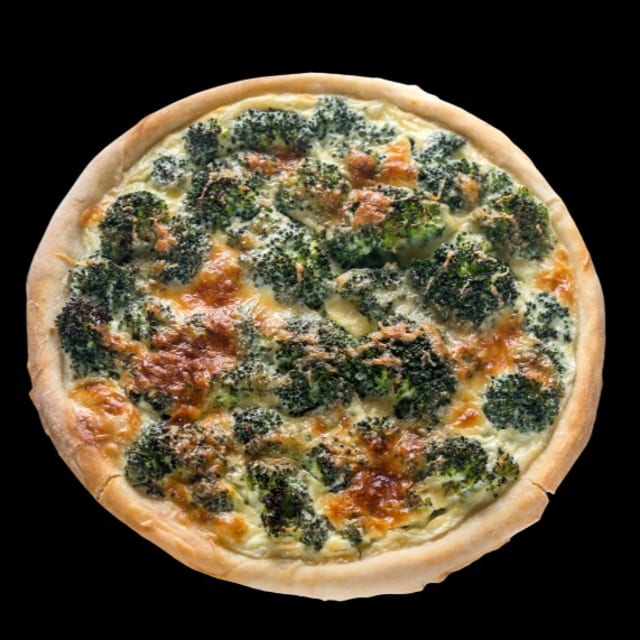 Chicken broccoli pizza slice.